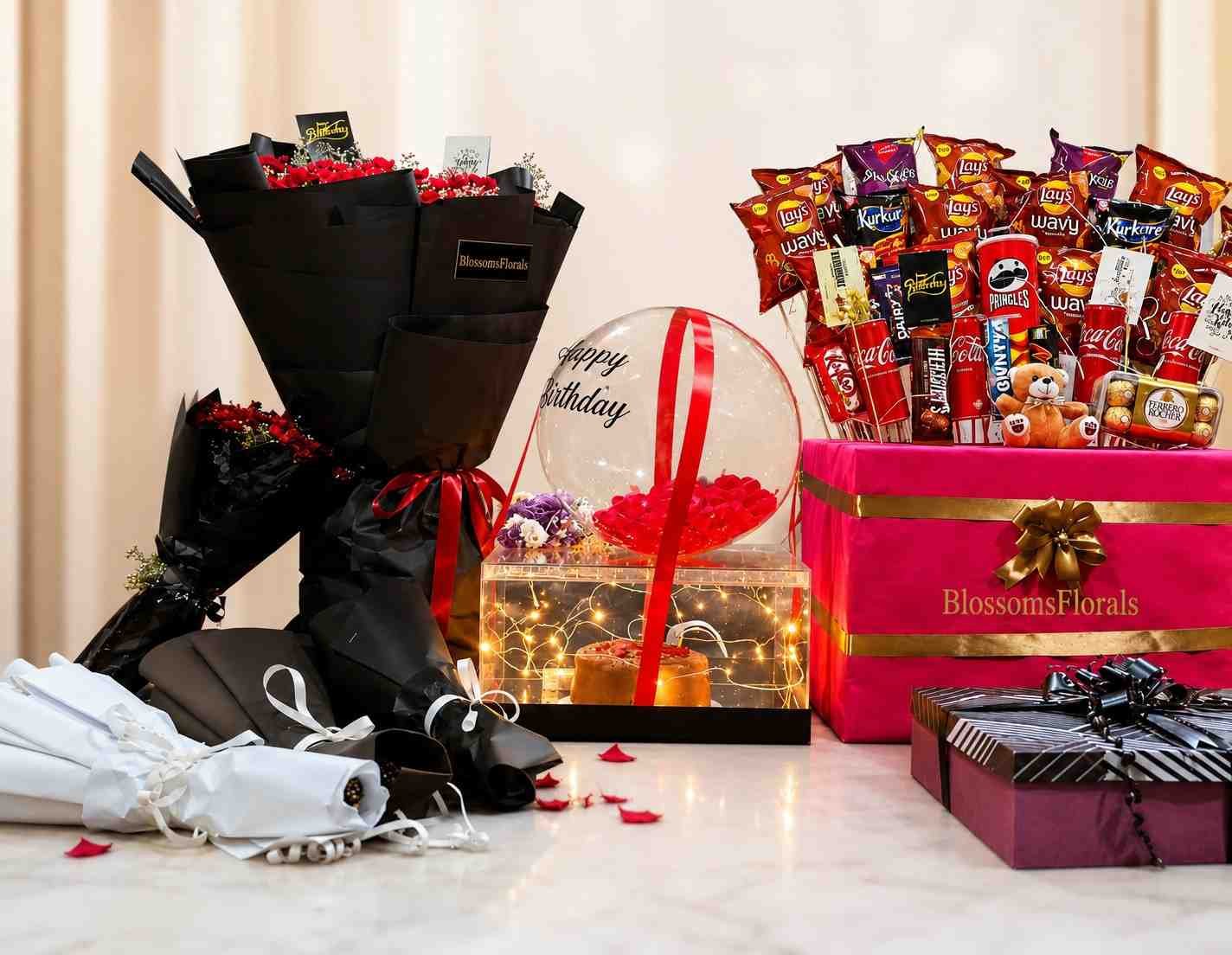 birthday gift hamper Pakistan with flowers and snacks